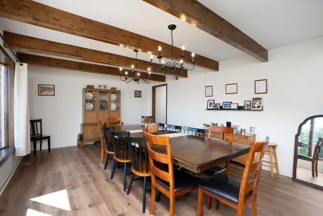a living room with furniture a rug and a fireplace