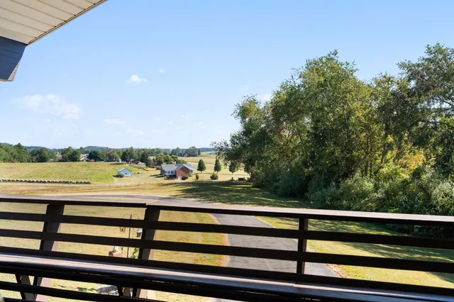 a view of a balcony with wooden floor