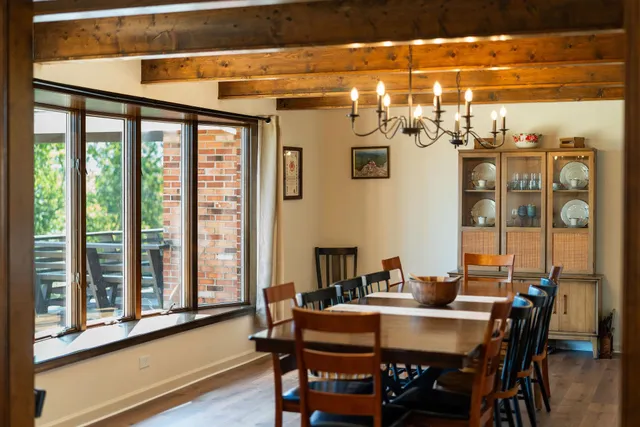 a view of a dining room with furniture window and outside view