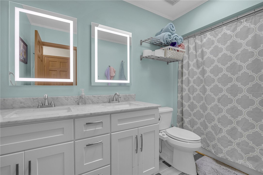 1002 Berkeley Drive Clemson, SC 29631 - Photo 11 of 23 This bathroom features dual illuminated mirrors and extensive vanity storage for a refreshing start to the day.