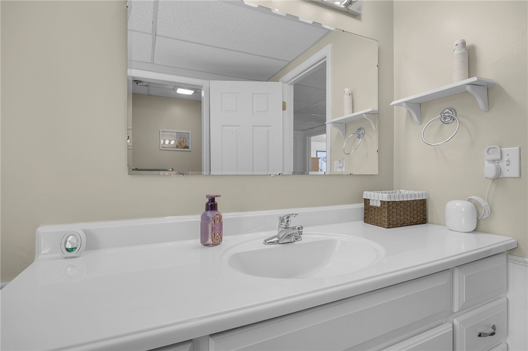1002 Berkeley Drive Clemson, SC 29631 - Photo 18 of 23 This bright bathroom features a spacious vanity and a large mirror, creating an inviting and functional space.