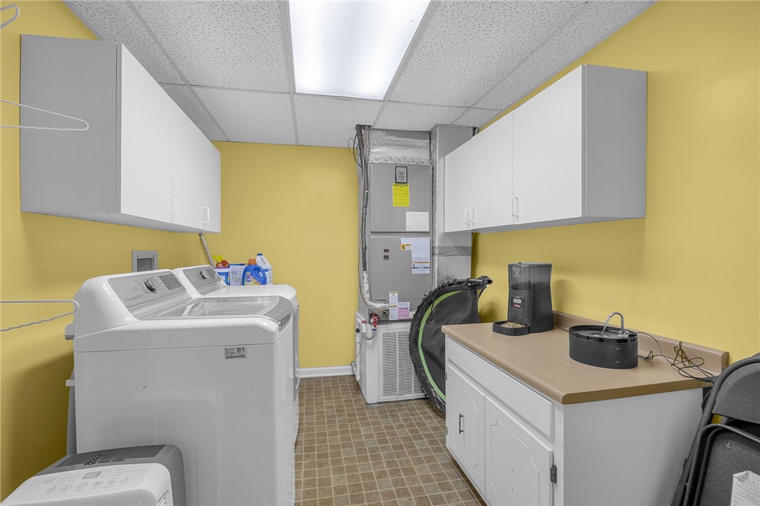 1002 Berkeley Drive Clemson, SC 29631 - Photo 19 of 23 This dedicated utility room offers ample storage and efficient appliances for daily tasks.