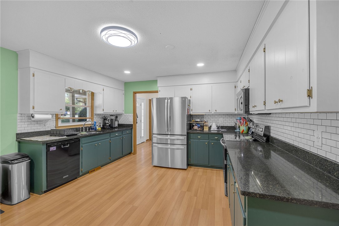1002 Berkeley Drive Clemson, SC 29631 - Photo 2 of 23 This spacious kitchen offers ample countertop space, modern appliances, and convenient built-in storage.
