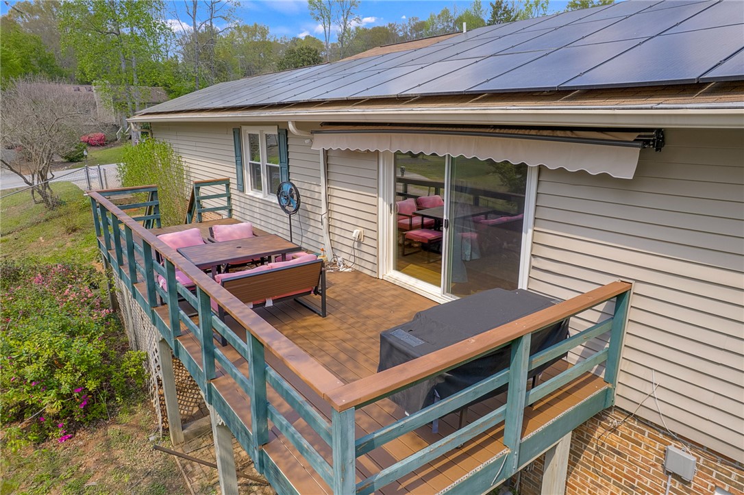 1002 Berkeley Drive Clemson, SC 29631 - Photo 21 of 23 This spacious deck, equipped with solar panels, offers comfortable outdoor living.