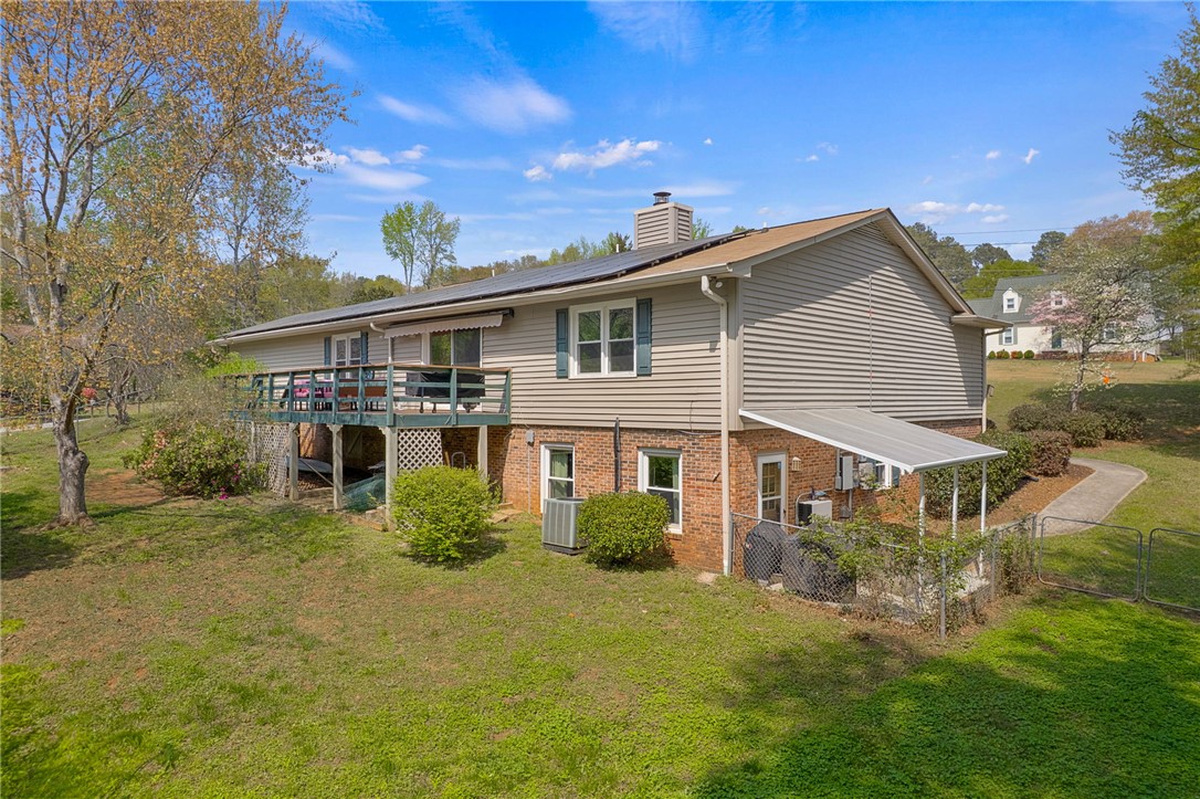 1002 Berkeley Drive Clemson, SC 29631 - Photo 22 of 23 This house features a spacious deck, ample yard space, and solar panels for energy efficiency.