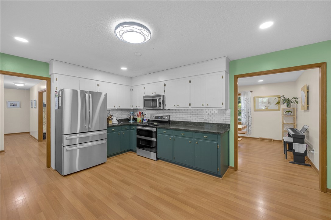 1002 Berkeley Drive Clemson, SC 29631 - Photo 4 of 23 This bright kitchen features modern appliances and a spacious layout, perfect for daily living and entertaining.
