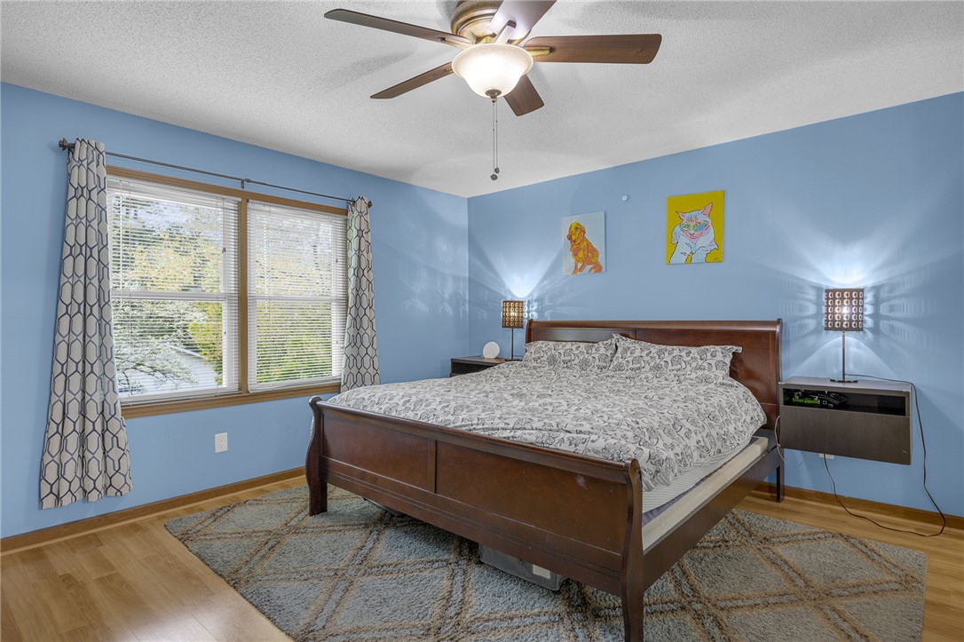 1002 Berkeley Drive Clemson, SC 29631 - Photo 7 of 23 This inviting bedroom features hardwood flooring and a ceiling fan, creating a comfortable retreat.