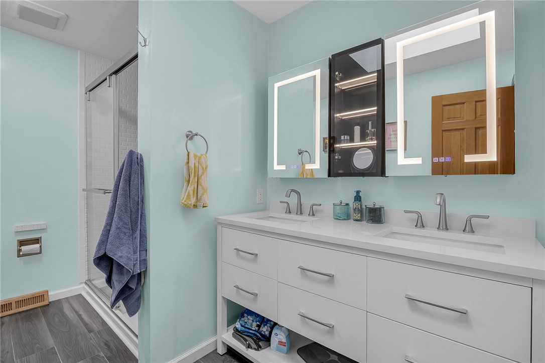 1002 Berkeley Drive Clemson, SC 29631 - Photo 8 of 23 This bathroom features a double vanity and a sleek, modern design with ample storage and a spacious shower.