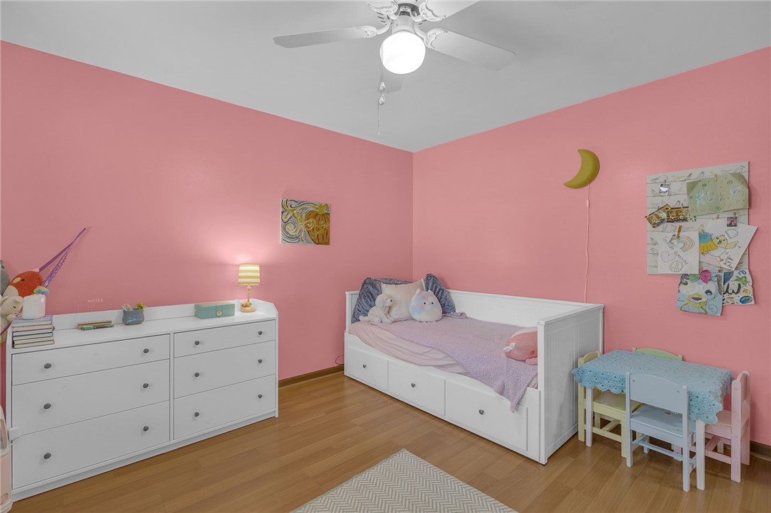 1002 Berkeley Drive Clemson, SC 29631 - Photo 10 of 23 This cheerful bedroom features wood flooring, offering a warm and inviting atmosphere.