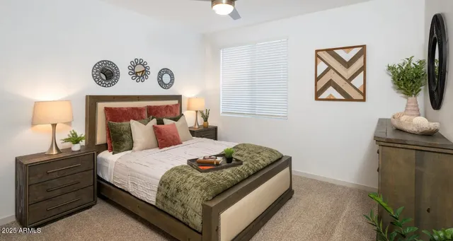 a bedroom with a bed and a table in it