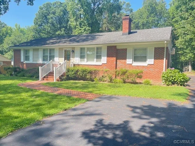 a house view with swimming pool and garden space
