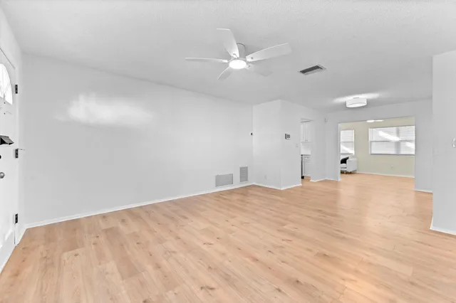 a view of an empty room and window