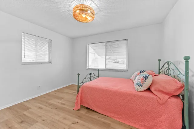 a bedroom with a bed and dresser