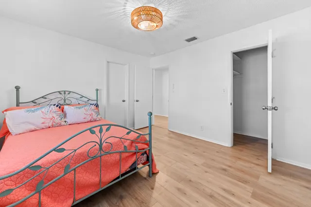 a bedroom with a bed and a table in it