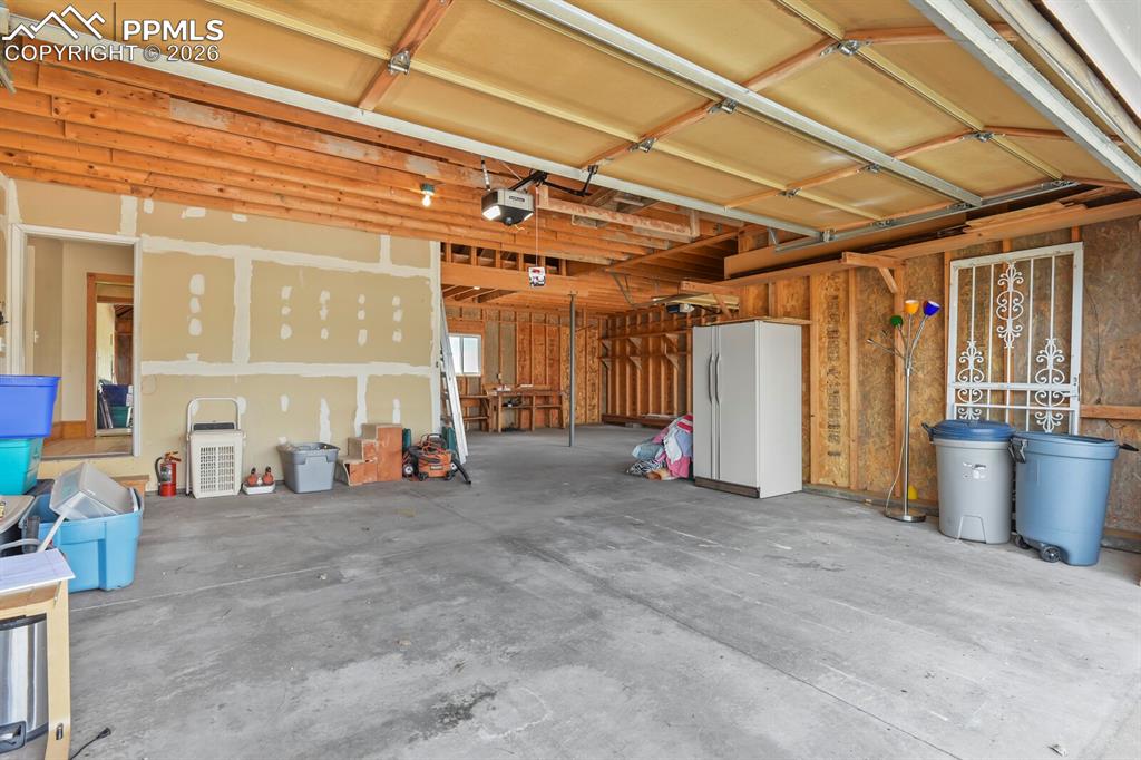 11505 Salinas Road Peyton, CO 80831 - Photo 29 of 37 a view of a room with wooden floor and furniture