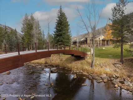 a view of a yard with a house covered with snow