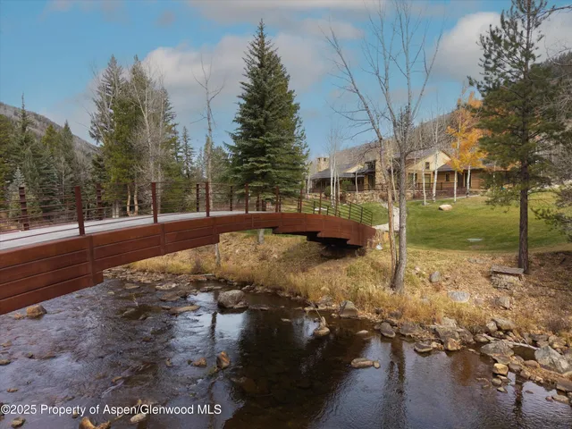 a view of a yard with a house covered with snow