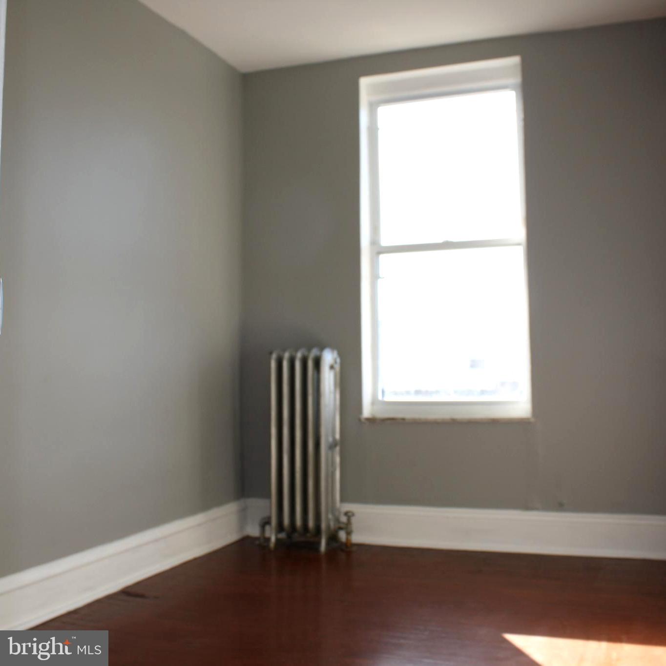 2634 South Daggett Street Philadelphia, PA 19142 - Photo 16 of 28 an empty room with a window