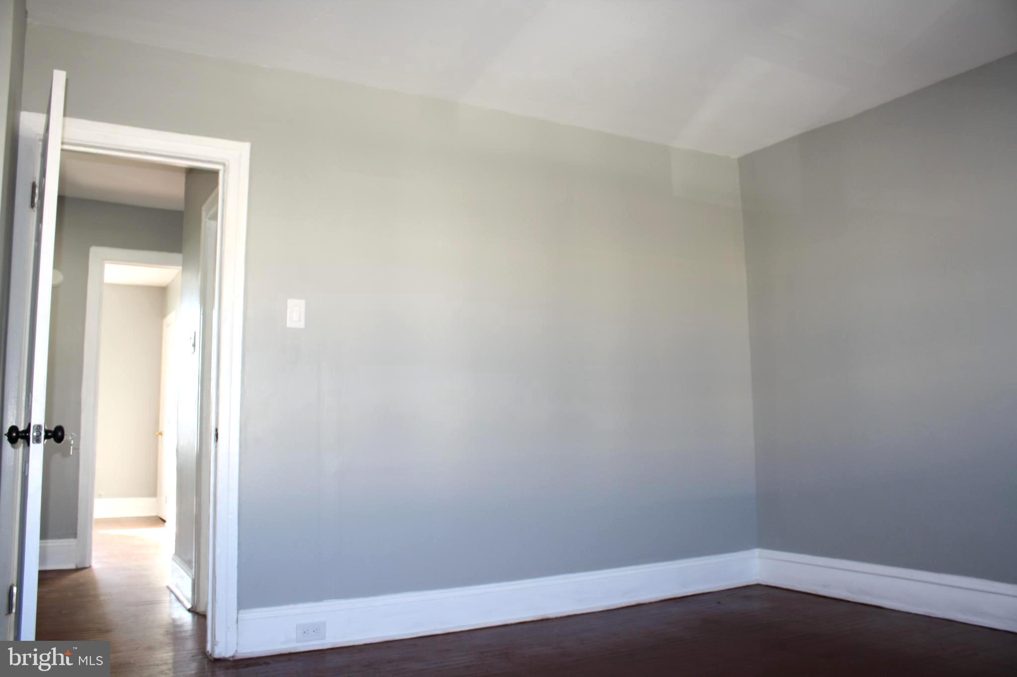 2634 South Daggett Street Philadelphia, PA 19142 - Photo 18 of 28 wooden floor in an empty room