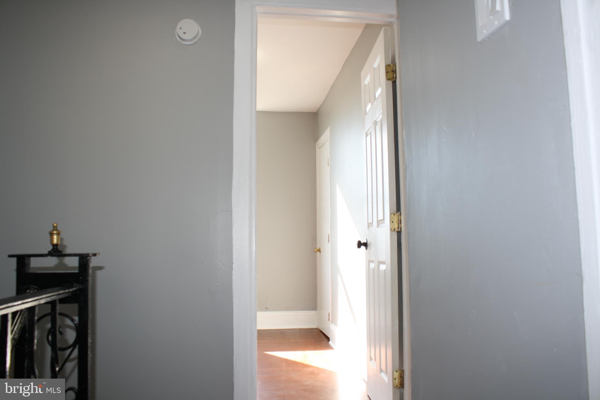 2634 South Daggett Street Philadelphia, PA 19142 - Photo 22 of 28 a view of a bathroom from a corridor