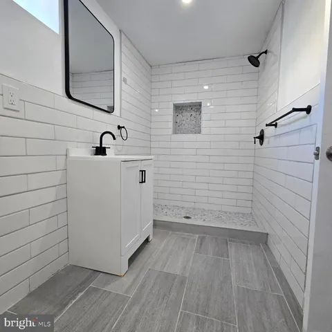 a bathroom with a sink and mirror