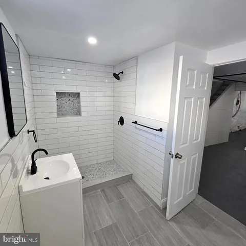 a bathroom with a bathtub and shower