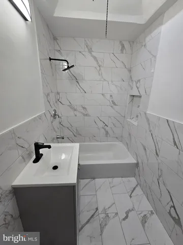 a bathroom with a sink and a bathtub