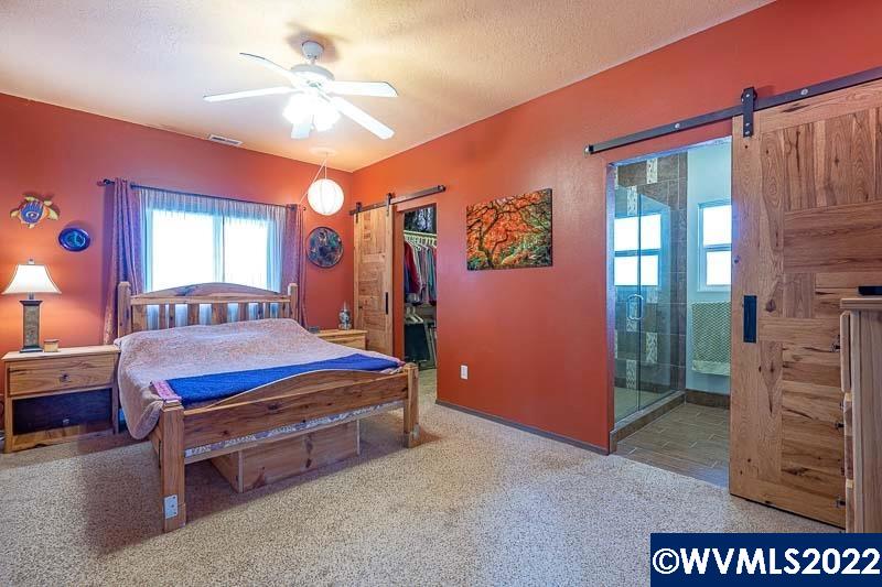 1569 Briar Road Independence, OR 97351 - Photo 9 of 24 a bedroom with a bed and a dresser
