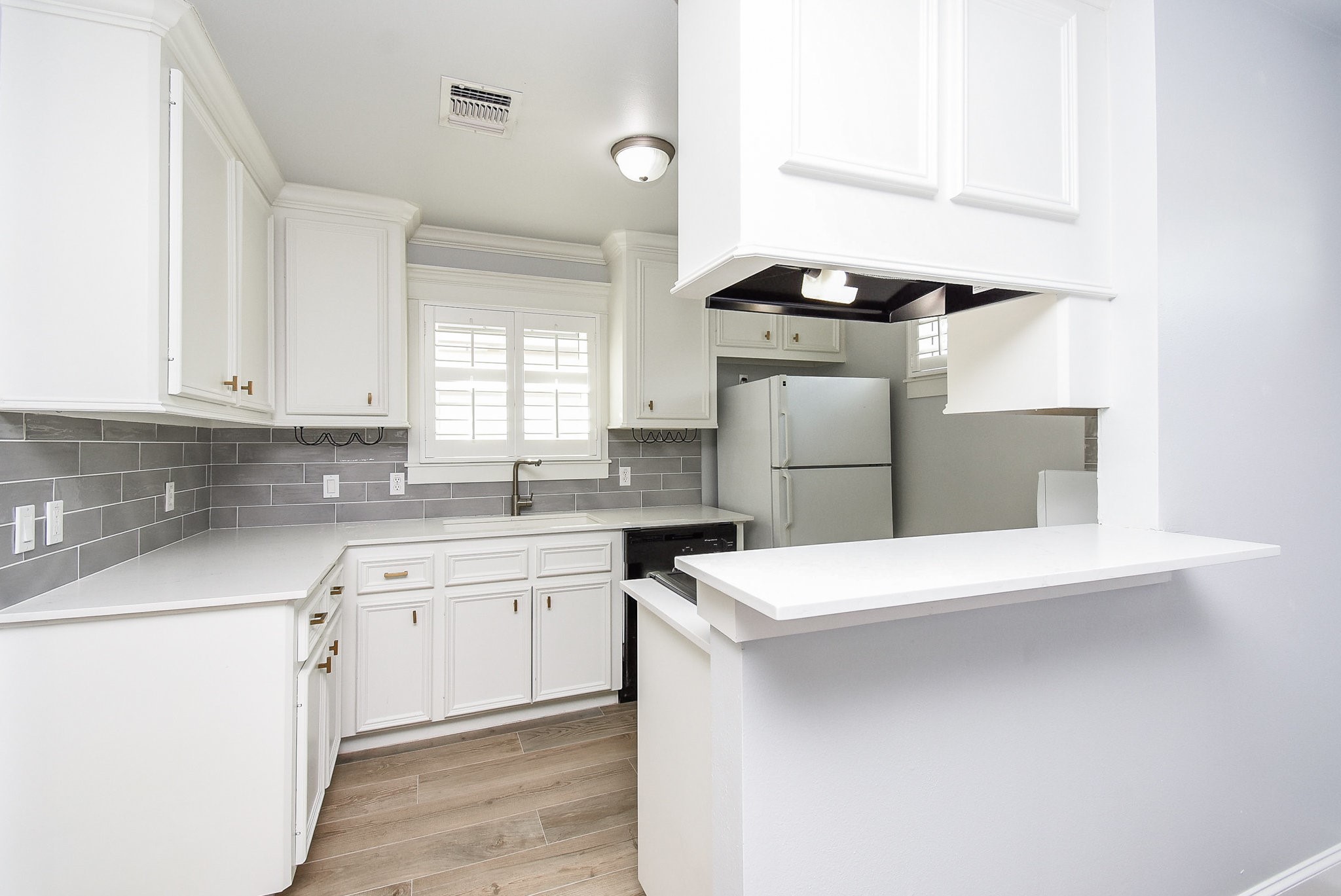 1349 Heights Boulevard, Unit B Houston, TX 77008 - Photo 14 of 32 a kitchen with stainless steel appliances a sink stove and cabinets