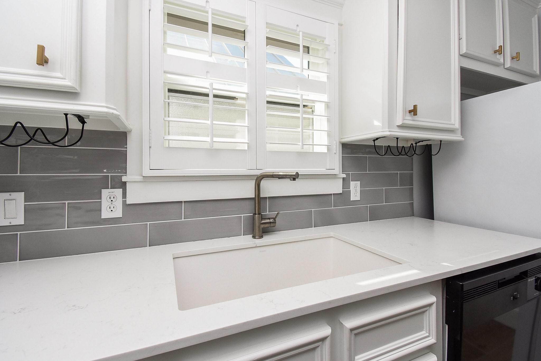 1349 Heights Boulevard, Unit B Houston, TX 77008 - Photo 16 of 32 a kitchen with a sink and a window