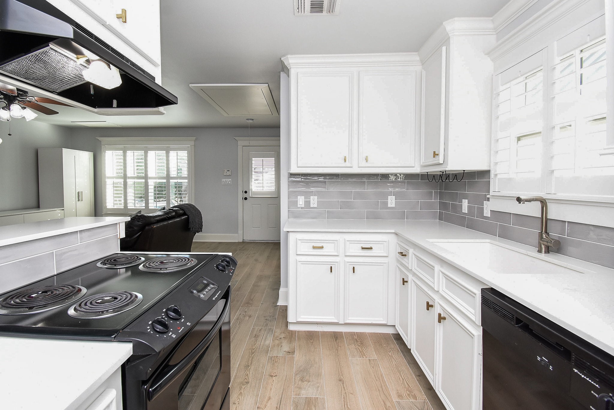 1349 Heights Boulevard, Unit B Houston, TX 77008 - Photo 18 of 32 a kitchen with stainless steel appliances a stove a sink and a refrigerator