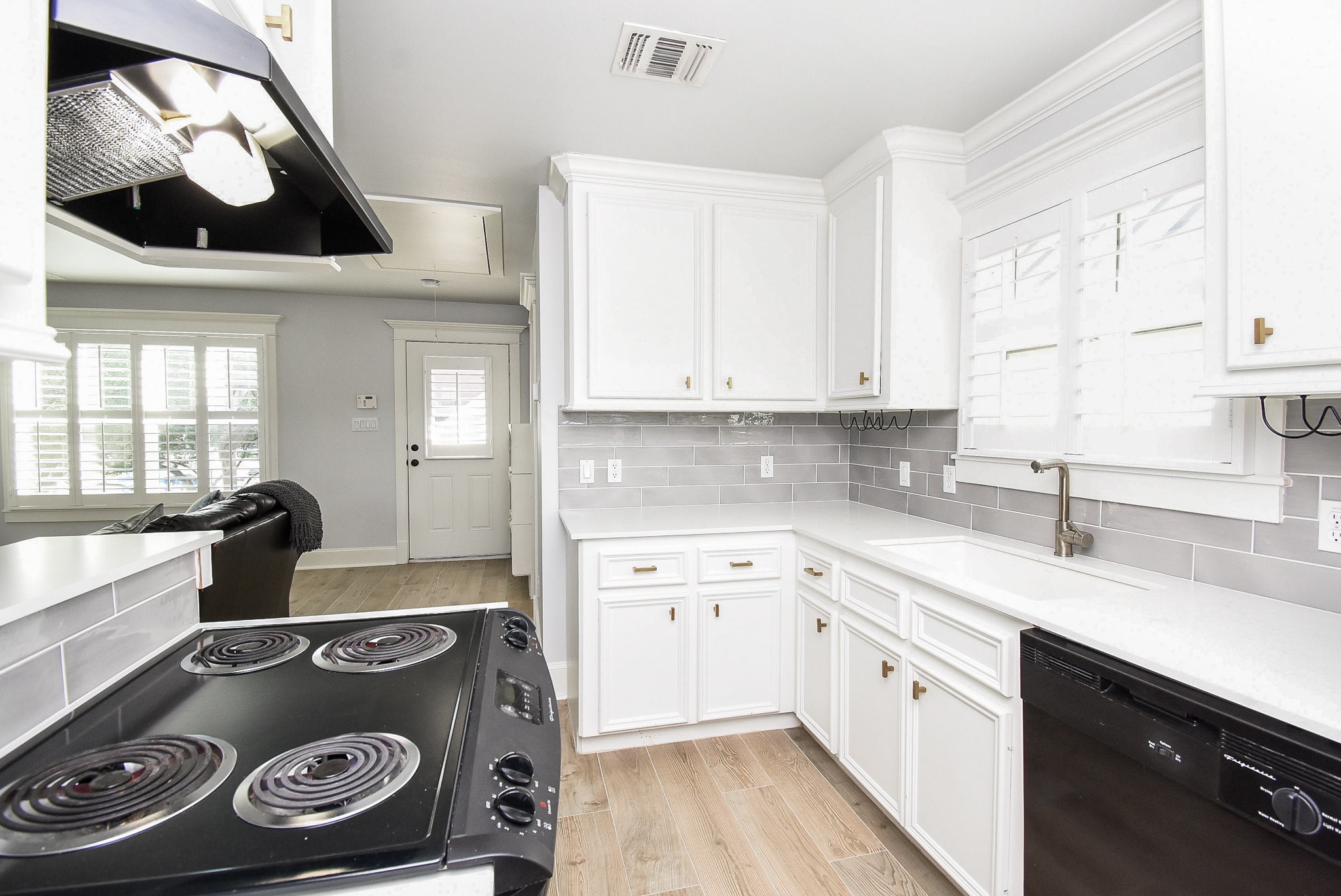 1349 Heights Boulevard, Unit B Houston, TX 77008 - Photo 19 of 32 a kitchen with a stove and a sink