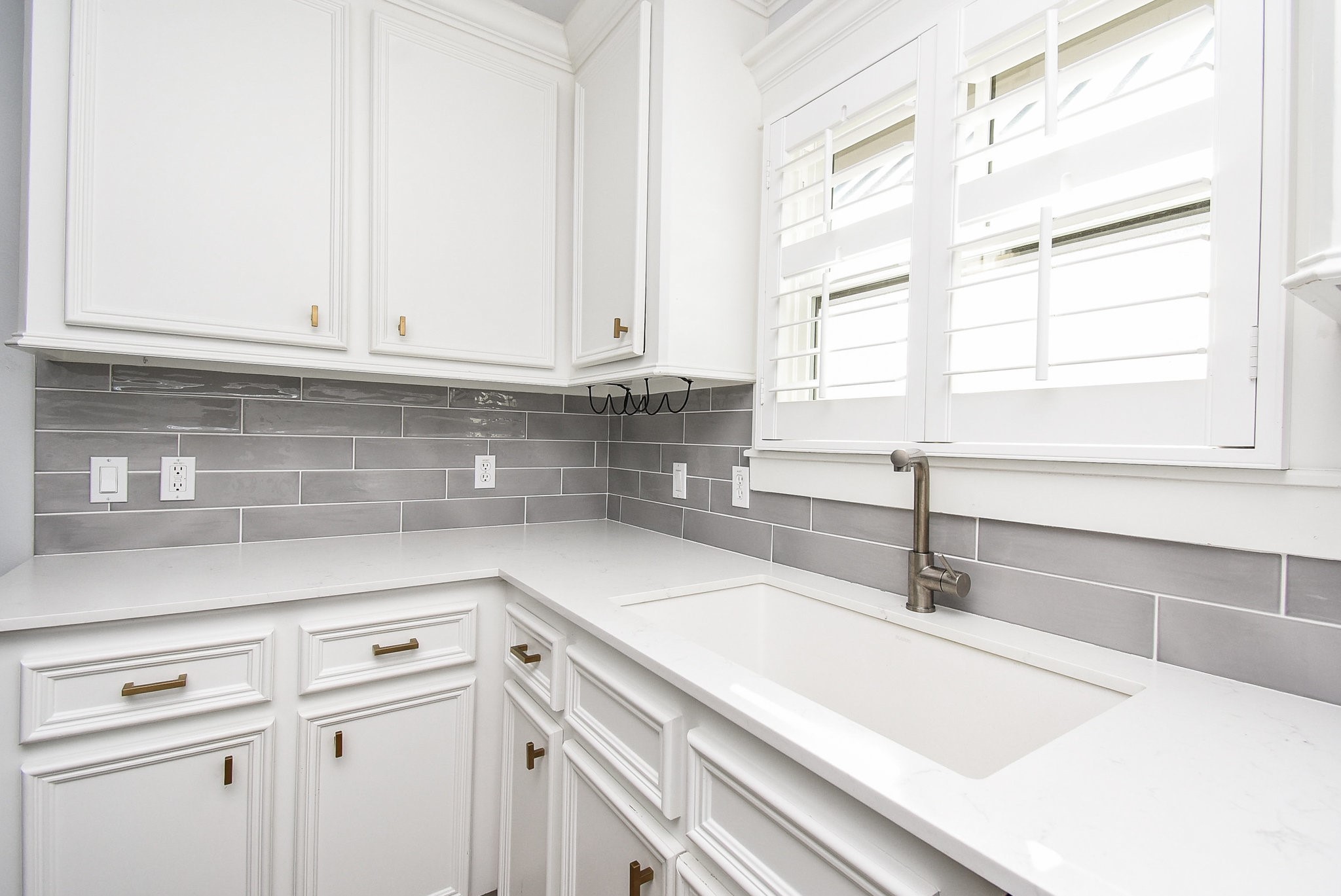 1349 Heights Boulevard, Unit B Houston, TX 77008 - Photo 20 of 32 a kitchen with granite countertop a sink and a window
