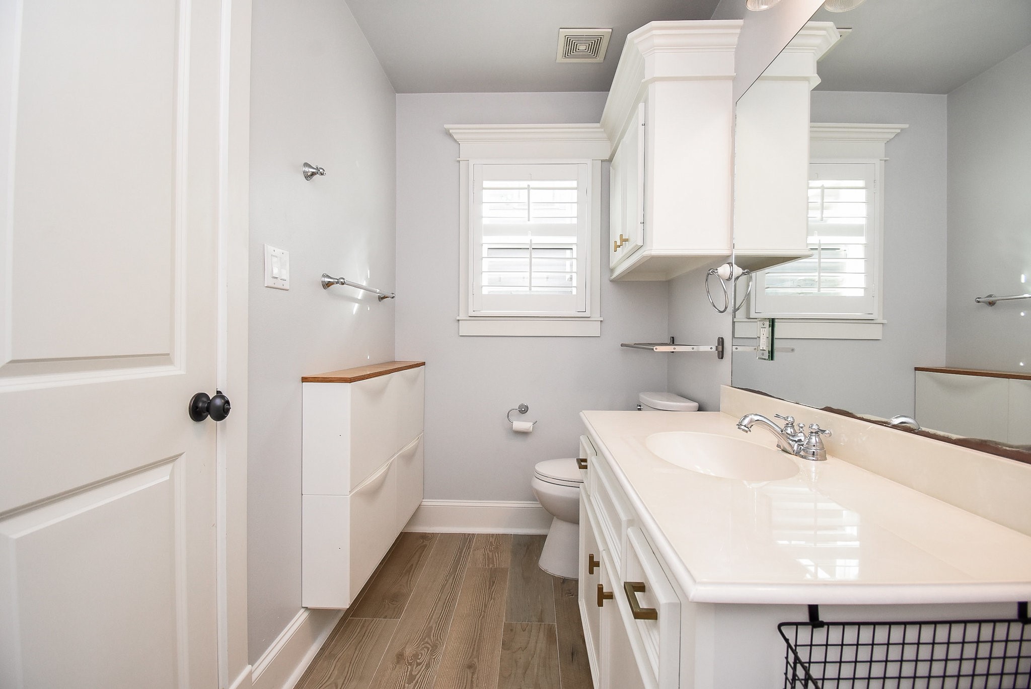 1349 Heights Boulevard, Unit B Houston, TX 77008 - Photo 22 of 32 a bathroom with a sink a toilet and a window