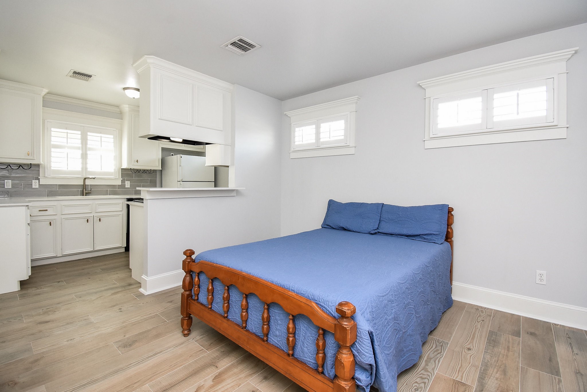 1349 Heights Boulevard, Unit B Houston, TX 77008 - Photo 10 of 32 a kitchen with stainless steel appliances a sink cabinets and wooden floor