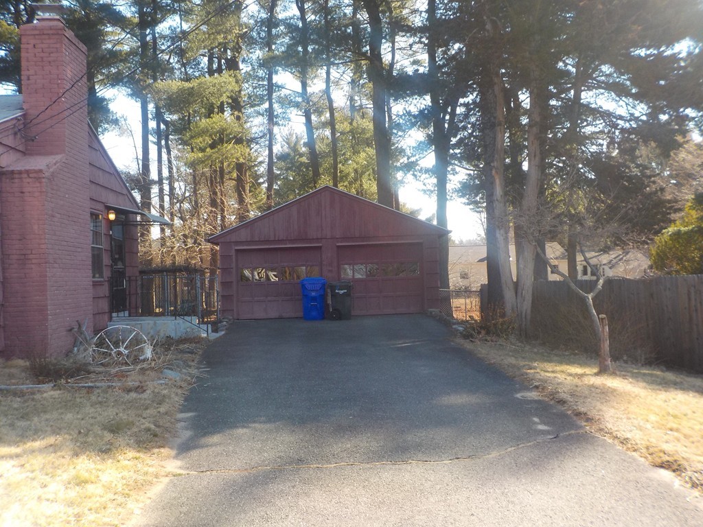 91 Dewitt Street Springfield, MA 01129 - Photo 2 of 15 a view of a house with a yard and tree