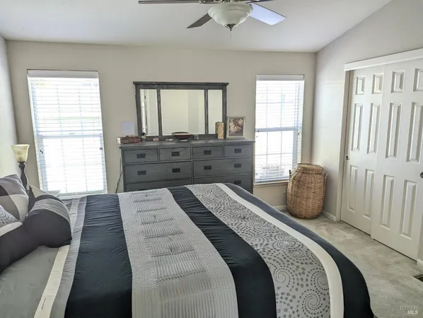 a bed room with a bed and a window
