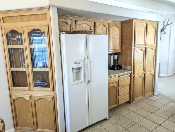 a kitchen with stainless steel appliances a refrigerator and a stove