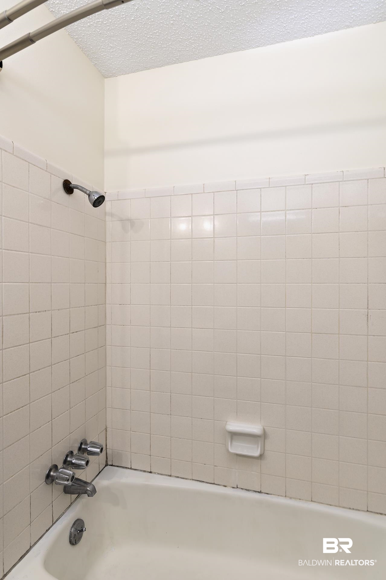707 Johnson Avenue Fairhope, AL 36532 - Photo 24 of 38 Bathroom with a textured ceiling and shower combination