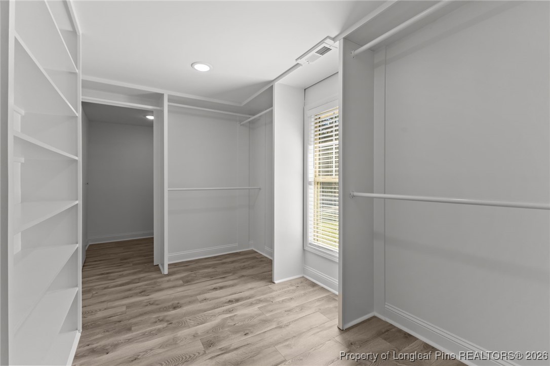 502 North Stewart Street Raeford, NC 28376 - Photo 20 of 48 an empty room with wooden floor closet and windows