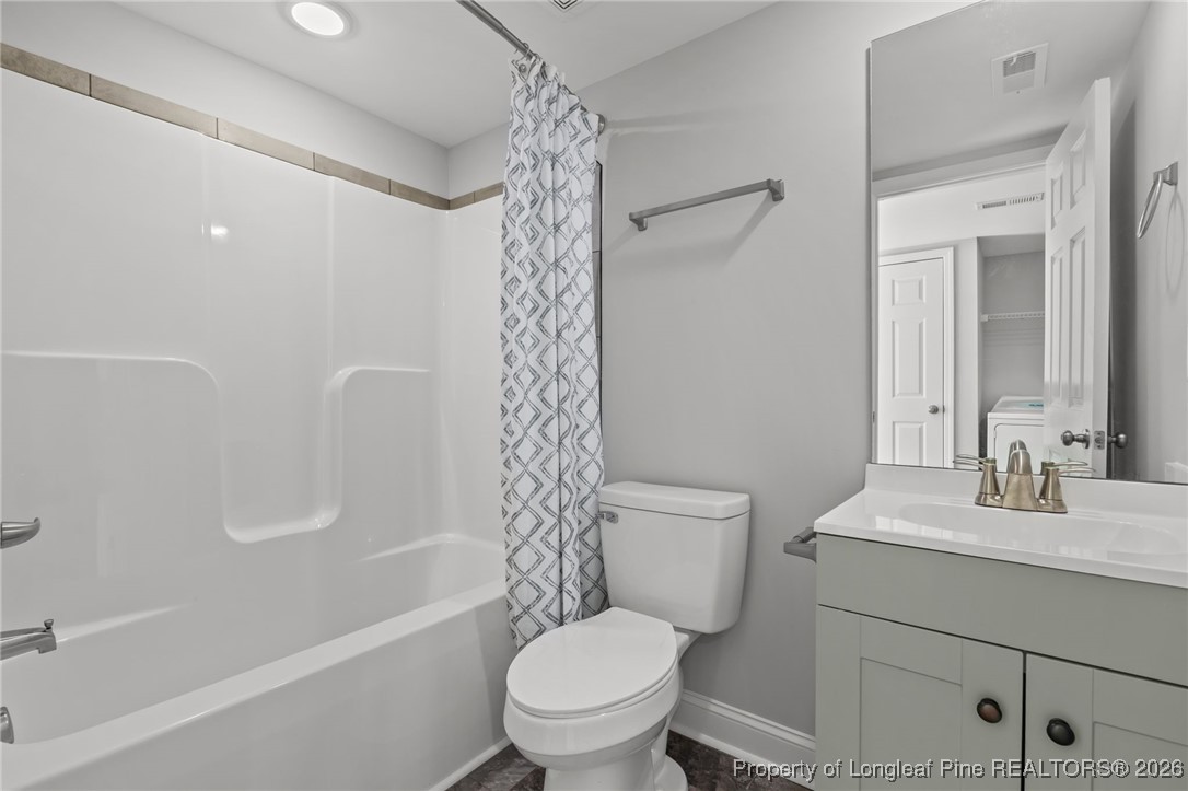 502 North Stewart Street Raeford, NC 28376 - Photo 26 of 48 a bathroom with a sink a toilet and shower