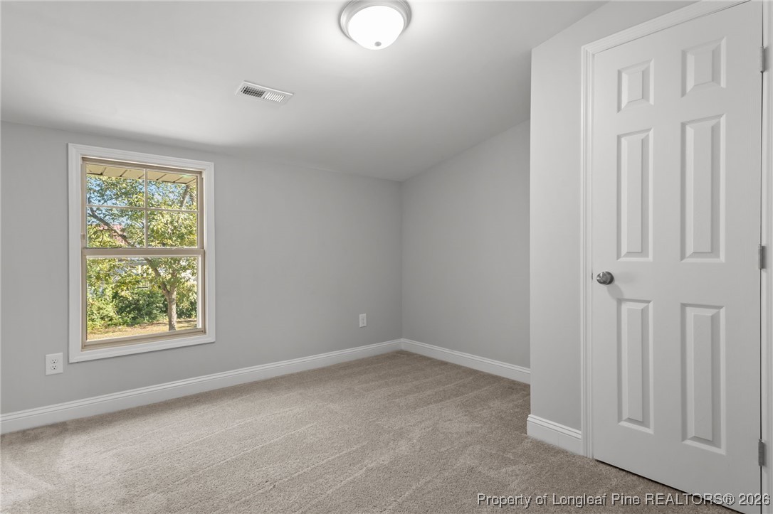 502 North Stewart Street Raeford, NC 28376 - Photo 29 of 48 an empty room with windows
