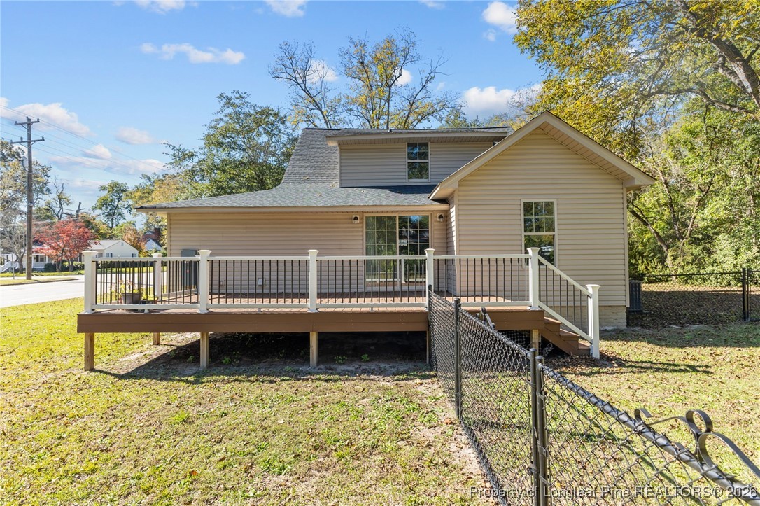 502 North Stewart Street Raeford, NC 28376 - Photo 40 of 48 a view of a house with a wooden deck