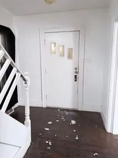 a view of entryway with wooden floor