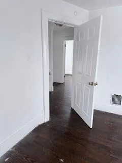 a bathroom with a toilet and shower