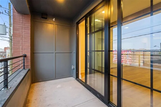 a view of a glass door and an empty room