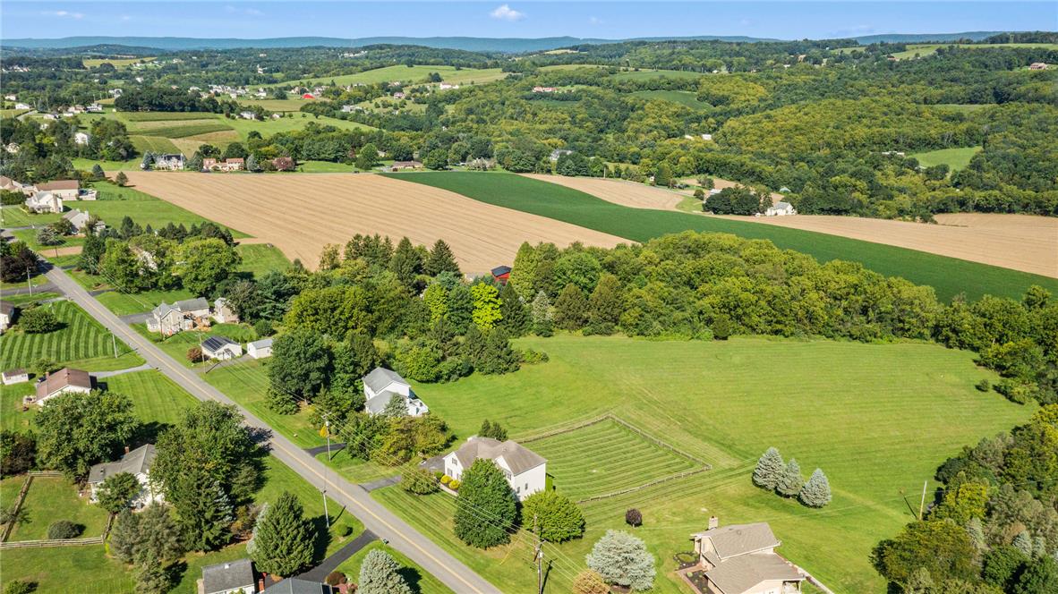 2617 Rising Sun Road Slatington, PA 18080 - Photo 55 of 58 Rolling green hills and expansive countryside vistas frame this scenic aerial landscape.