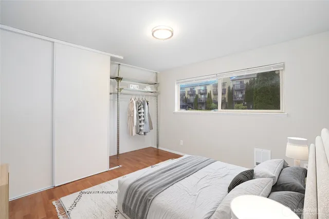 a bedroom with a bed and a couch