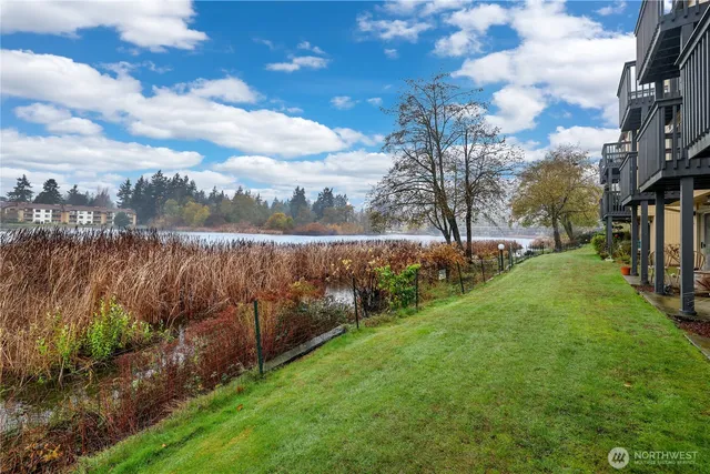a view of a lake with houses in the back