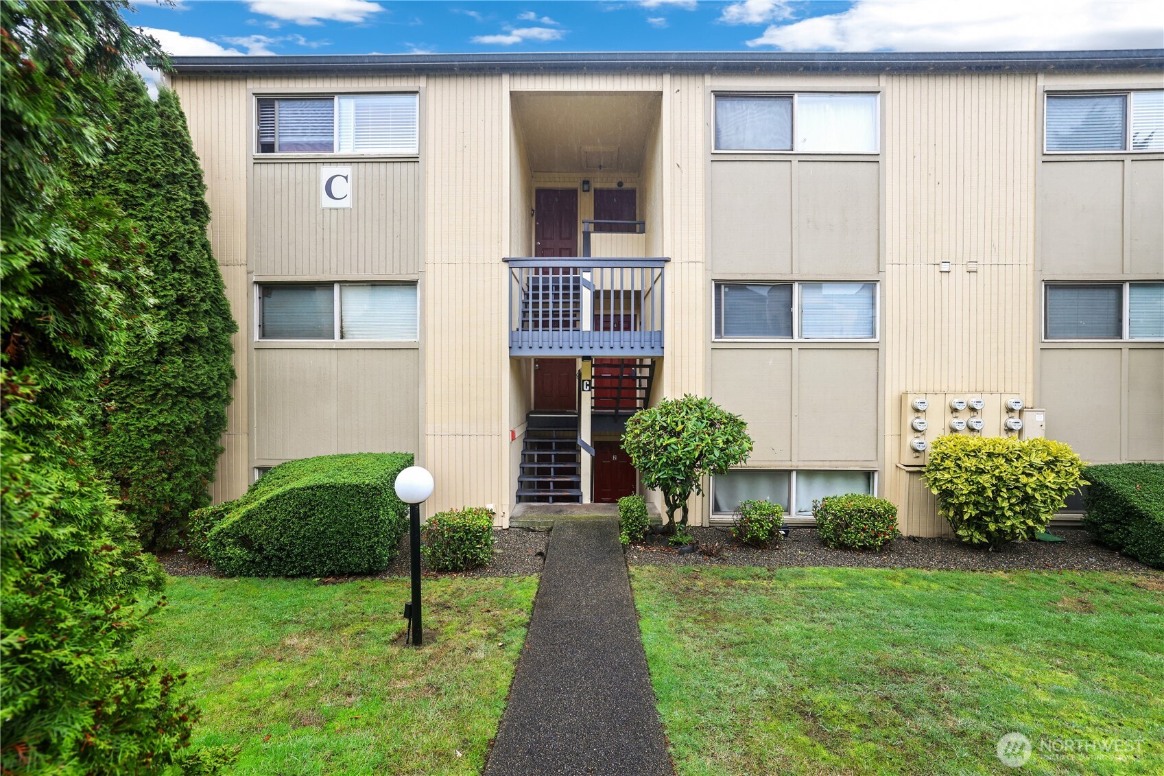 31003 14th Avenue South, Unit C4 Federal Way, WA 98003 - Photo 2 of 22 a view of a house with a garden and plants